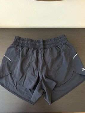 all in motion Black Women's Athletic Running Shorts with Reflective Trim.